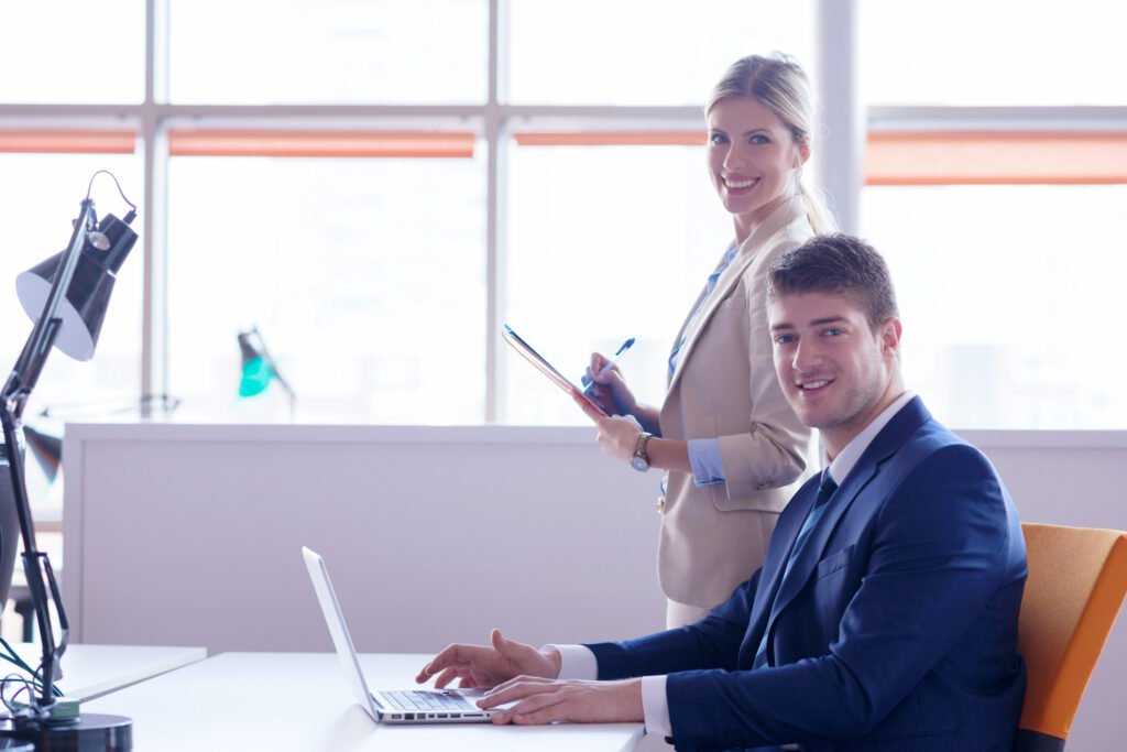 man and woman in office