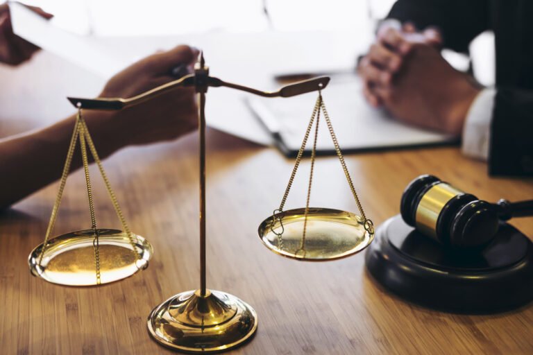 A specialist solicitor discusses eye injury claims with a client.