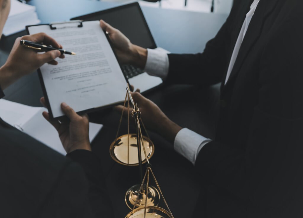 men signing documents