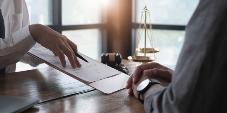 Medical negligence solicitor and client discussing retained placenta claim