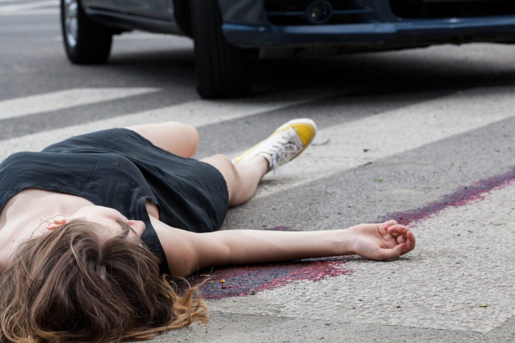 A woman has been hit by a car.